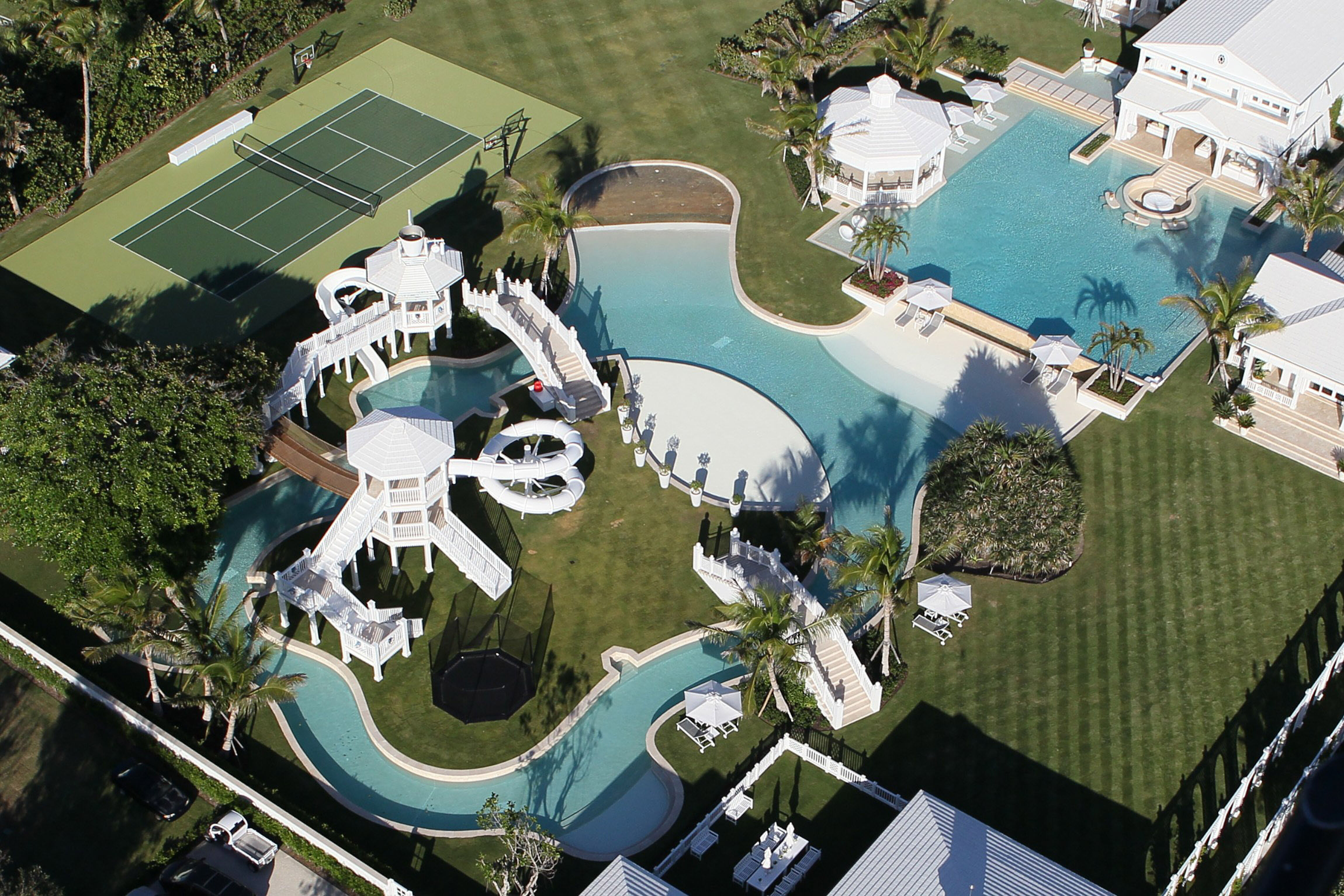 *File Photos* photos from Oct 28,2010. Celine Dion has slashed $30 million off the asking price of her Florida mansion following the death of her husband Rene Angelil. The 'My Heart Will Go On' singer originally listed the property in Jupiter Island, Florida, for $75 million in 2013. However, she has since cut the asking price by a staggering $30 million as she plans to live full time in Las Vegas. The breathtaking 10,000 sq ft residence, which sits on five acres of prime beachfront land, boasts water slides, a lazy river, a tree house and a tennis court. The main house has five bedrooms with five en-suite bathrooms, a formal living room with vaulted ceilings, a media room, an elevator and two kitchens.There are also two four-bedroom guest homes and a pool house. Last month, Celine also sold her home in Quebec for $25.5 million. Rene Angelil, who was a celebrated Canadian music producer, died earlier this year following a long battle with cancer. Pictured: Celine Dion's property on Jupiter Island, Florida Ref: SPL1240268 040316 Picture by: Splash News Splash News and Pictures Los Angeles: 310-821-2666 New York: 212-619-2666 London: 870-934-2666 photodesk@splashnews.com 