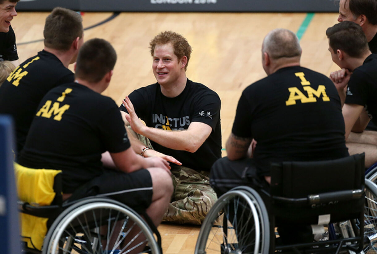 LONDON, ENGLAND - MARCH 06: Prince Harry (C) talks to injured soldier wheelchair basketball players at the lunch of the new international sporting event for wounded, injured and sick service personnel, the Invictus Games in the Copper Box at Queen Elizabeth Olympic Park on March 6, 2014 in London, England. (Photo by Danny Martindale/WireImage)