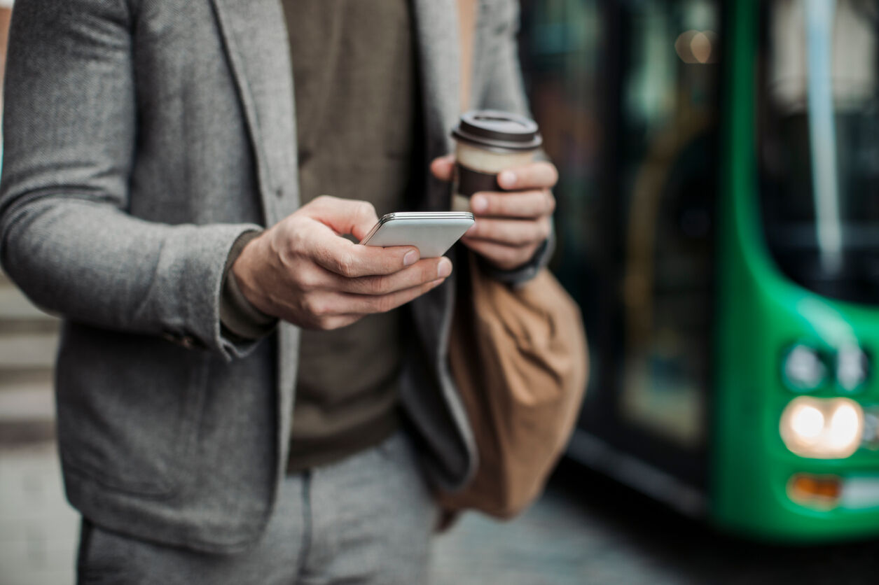 Photo of a businessman using mobile phone in the city