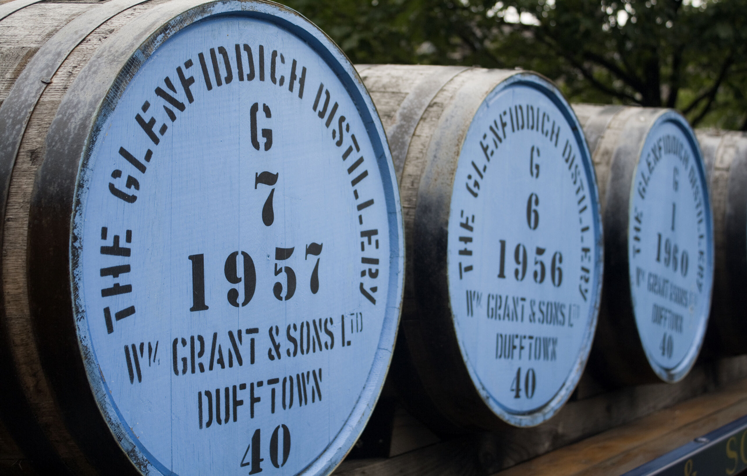 Dufftown Scotland - September 06, 2013: Whisky barrel's outside the Glenfiddich distillery in Dufftown. Glenfiddich is produced by the Glenfiddich Distillery, est. 1887 in Speyside, Scotland.