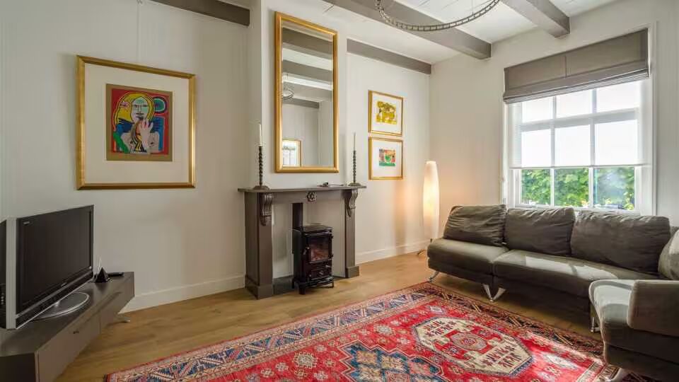 De woonkamer van de woning van Pure Luxe 