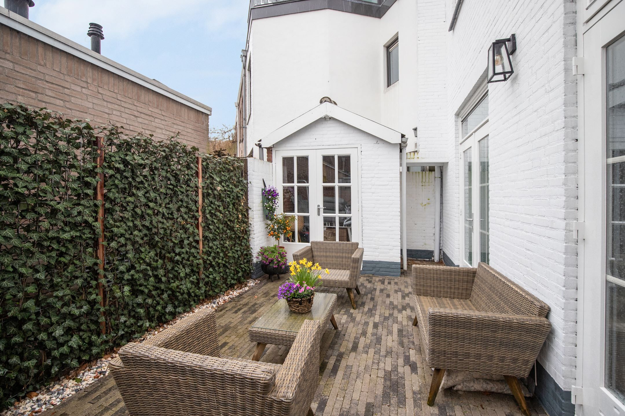 Achtertuin woonkamer Funda Breda woning
