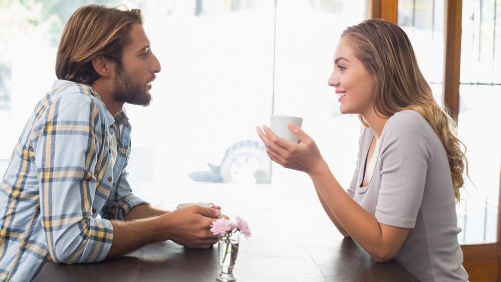 Happy couple enjoying a coffee at the coffee shop; activities; adult; and; attractive; beautiful; bright; business; cafe; cafeteria; caucasian; cheerful; coffee; communication; conversation; couple; cup; customer; day; discussion; drink; female; food; friend; friendship; half; handsome; happy; holding; house; indoors; industry; interacting; leisure; length; lifestyle; male; man; mug; off; pretty; relationship; relaxing; restaurant; retail; shop; side; sitting; smiling; speaking; talking; time; together; view; weekend; window; woman; young