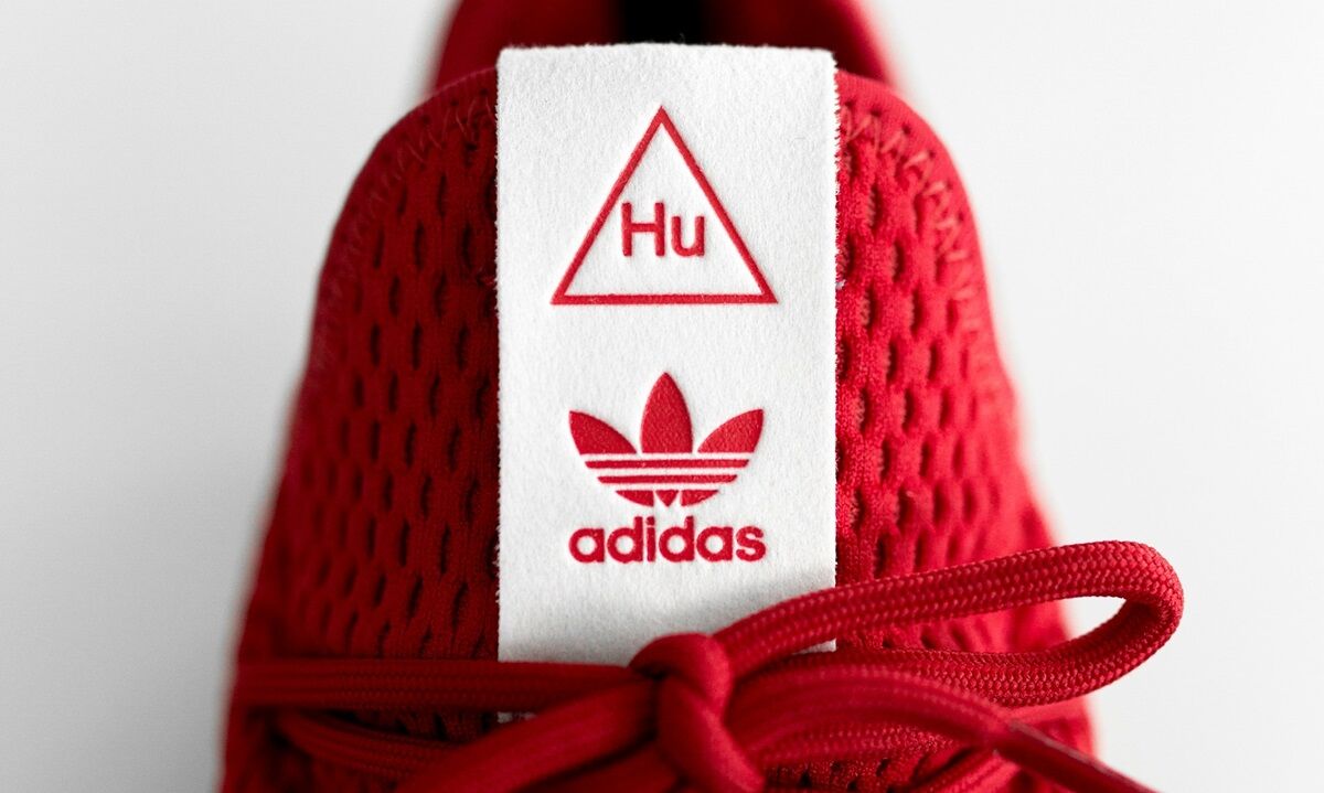 betekenis adidas logo