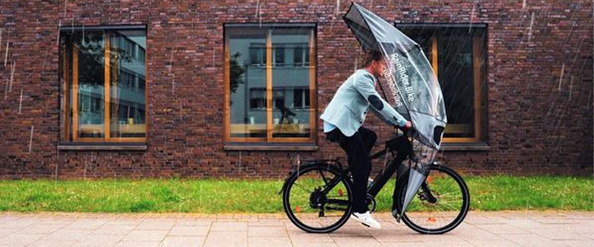 Van bloedhitte naar stortbui: dit regenschild is hét ultieme gadget voor op de fiets