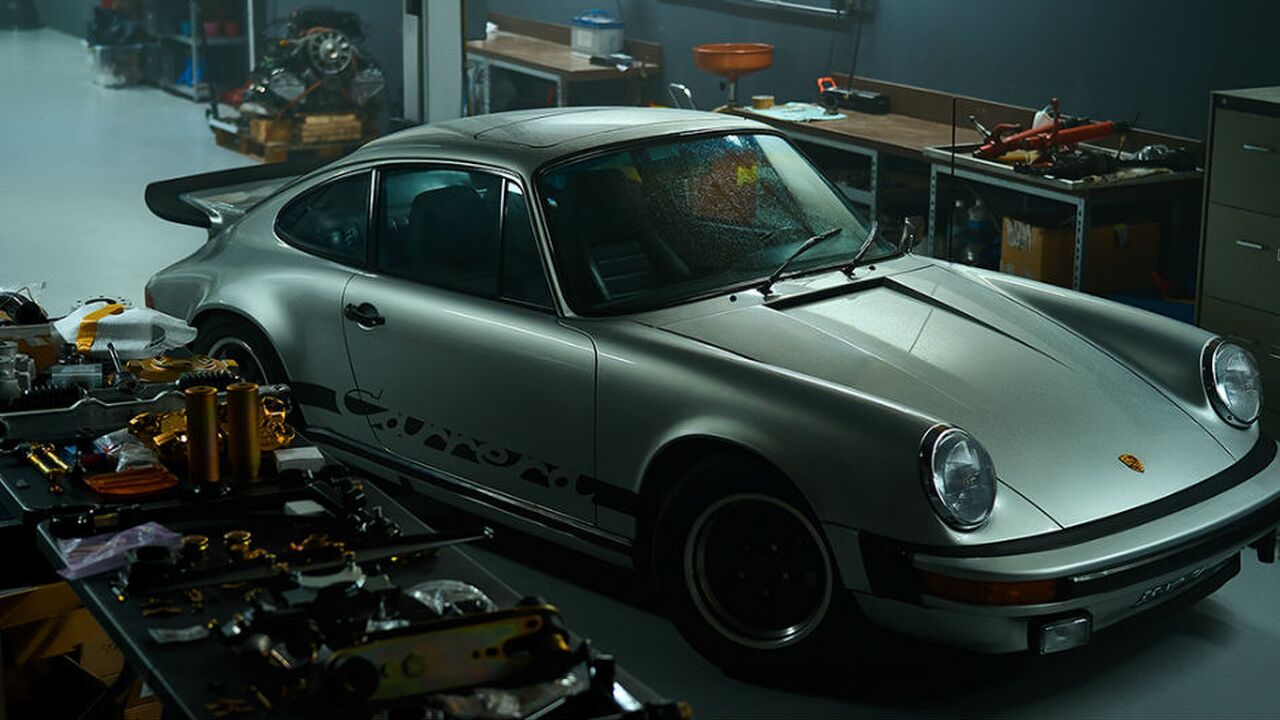 porsche garage man man
