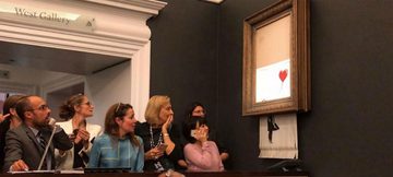Banksy zelfvernietigend schilderij MAN MAN