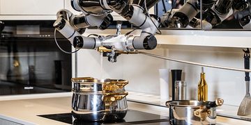 robot doet de afwas en kookt