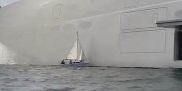botsling met luxe jacht en zeilboot
