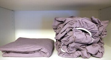 hoe hoeslaken goed opvouwen strak plat