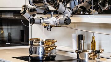 robot doet de afwas en kookt