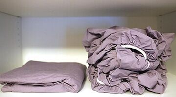 hoe hoeslaken goed opvouwen strak plat