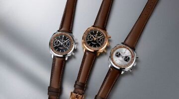 De horloges van Breitling en Aston Martin.